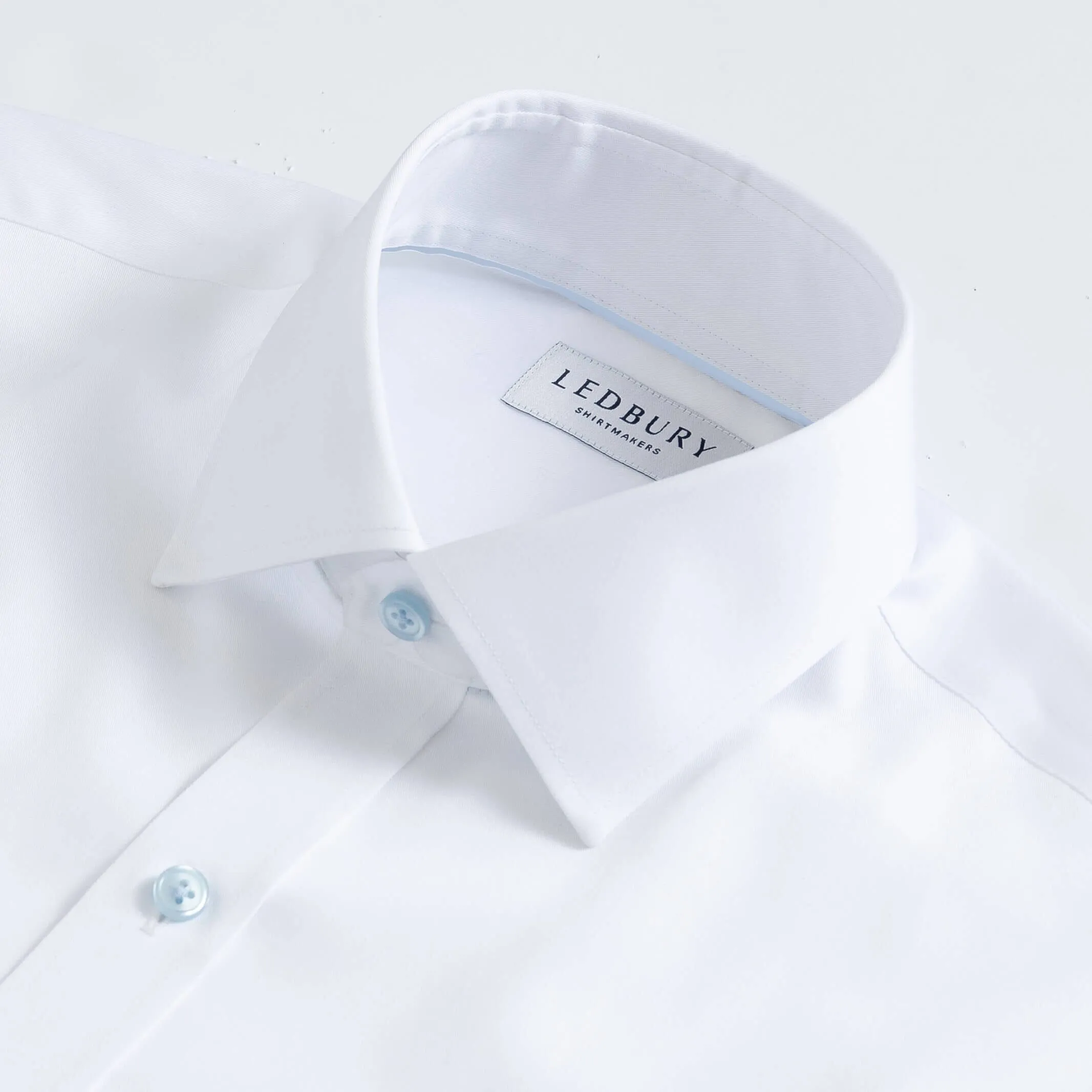 The White Madison Fine Twill with Light Blue Buttons Custom Shirt